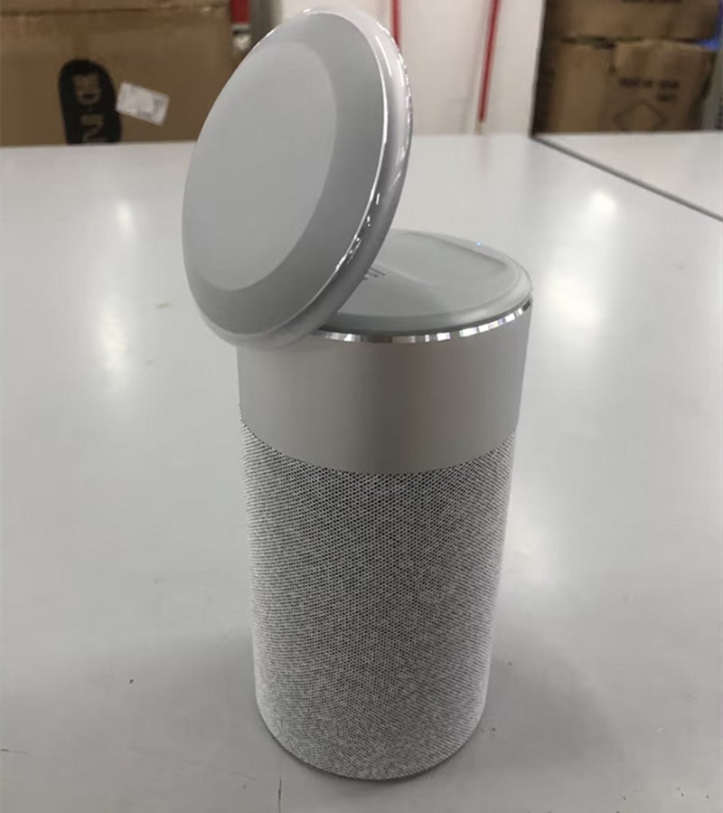 A three-in-one multi-functional iPhone and AirPods wireless charger, portable Bluetooth speaker, and touch lamp.