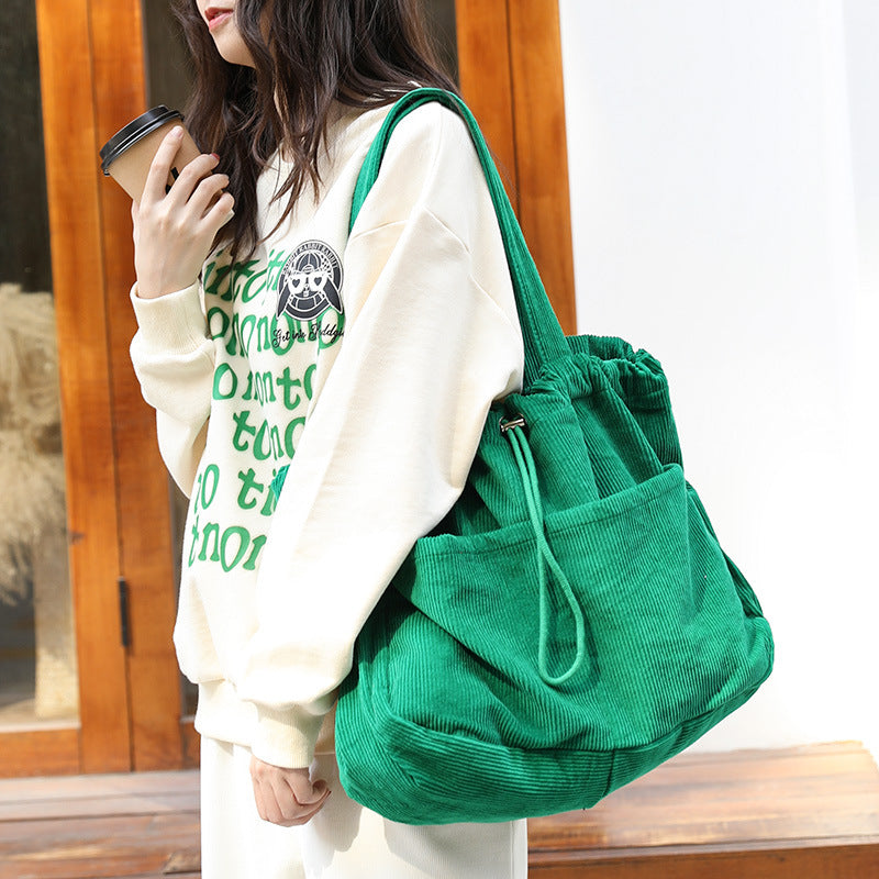 Corduroy Drawstring Multi-pocket Handbag